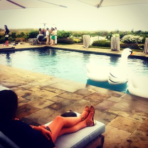 Under the umbrella and a sweater -- you can never be too covered.